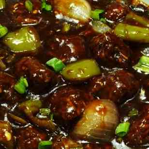 Savor the bold and savory flavors of Beef Manchurian Gravy, featuring succulent beef, vibrant vegetables, and a tantalizing blend of sweet and savory sauces for a delightful and zesty culinary experience
