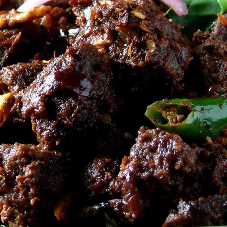 Succulent beef pepper dry dish with a flavorful blend of spices, aromatic peppercorns, and perfectly seared beef, offering a delightful and spicy culinary experience