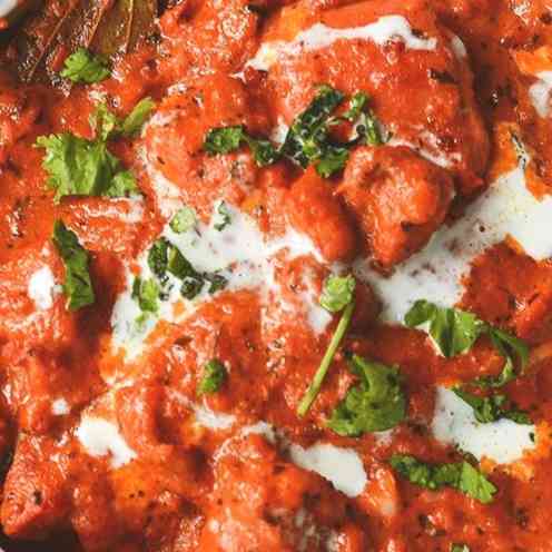 Indulge in the creamy goodness of Butter Chicken Gravy, featuring tender chicken, velvety tomato sauce, and a rich blend of spices for a delectable and comforting dining experience