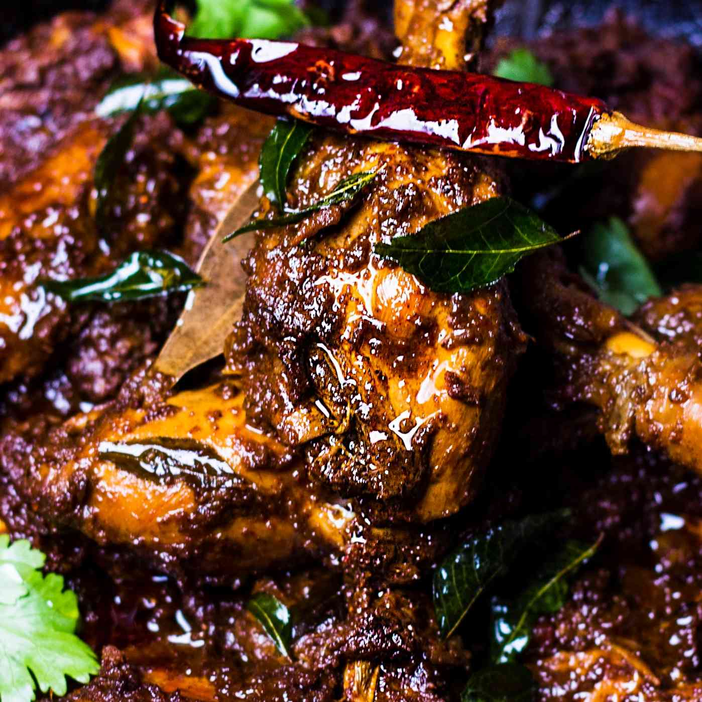 Chettinadu-style chicken dry dish with bold spices, aromatic curry leaves, and perfectly cooked chicken pieces, delivering an authentic and spicy South Indian gastronomic delight