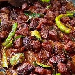 Indulge in the rich and aromatic flavors of Hyderabadi Beef Dry, featuring tender beef, aromatic spices, and a blend of Hyderabadi culinary traditions for a regal and delicious dining experience