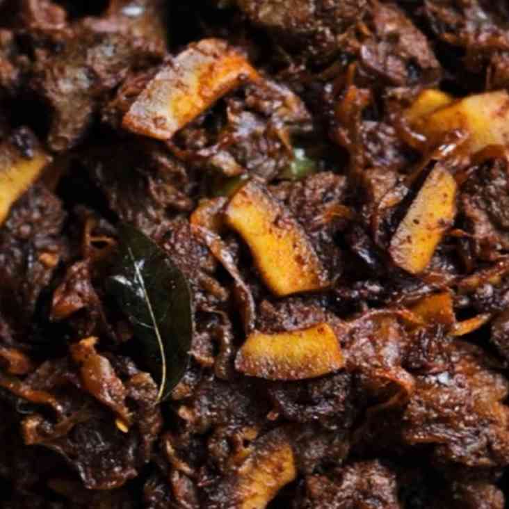 Kerala-style beef curry with fragrant spices, coconut, and slow-cooked tender beef, showcasing the authentic flavors of Kerala cuisine