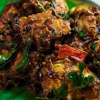 Traditional Kerala chicken curry with aromatic spices, coconut milk, and a rich blend of flavors, representing the authentic taste of Kerala cuisine
