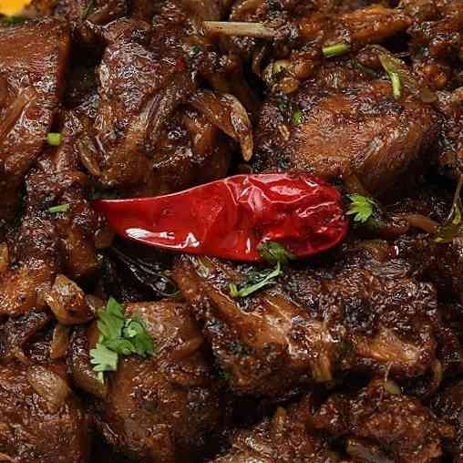Experience the authentic flavors of Mutton Chettinadu Dry, featuring tender mutton, aromatic spices, and a unique South Indian blend for a delightful and aromatic culinary adventure